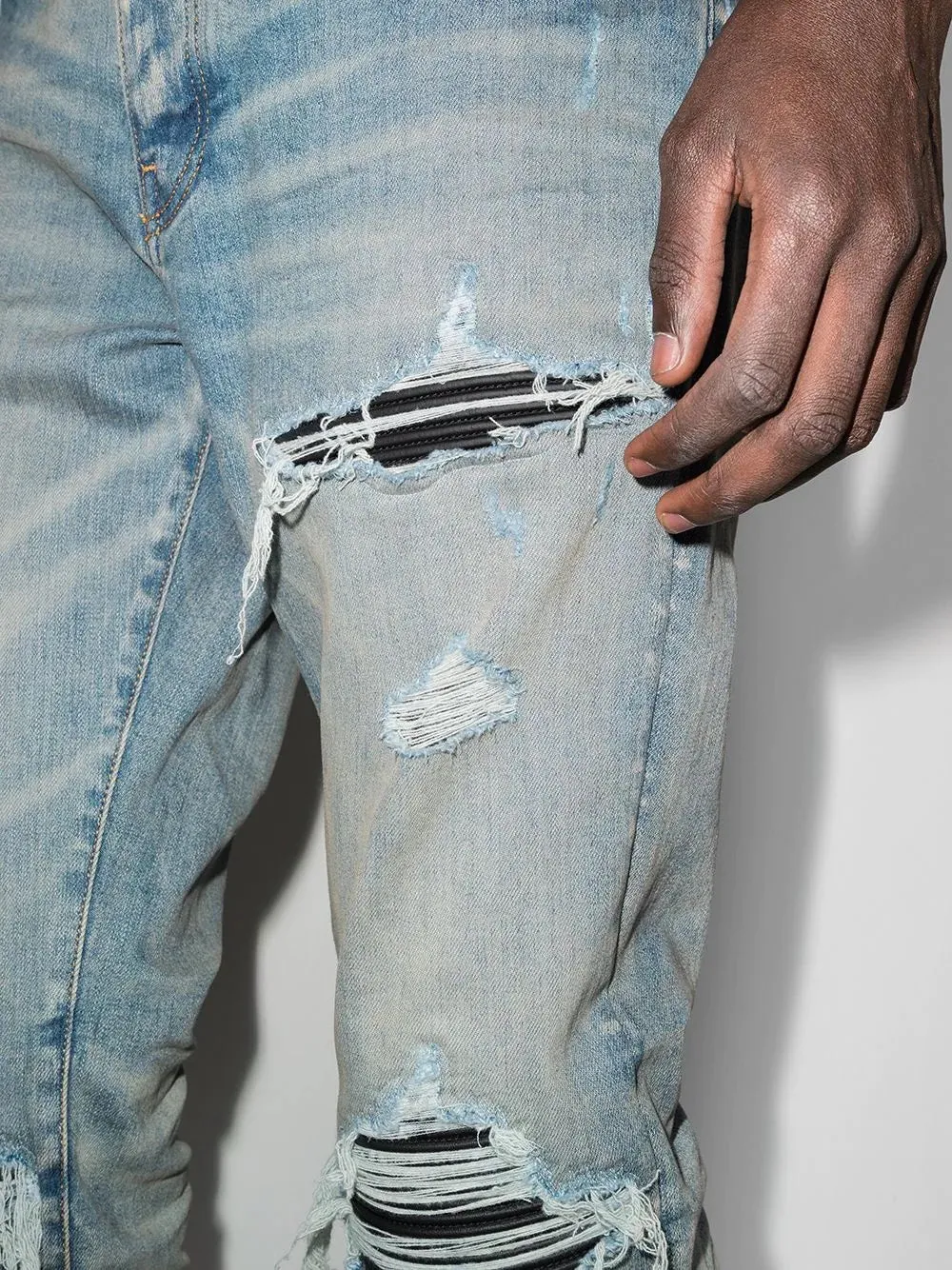 AMIRI MX1 DISTRESSED EFFECT SKINNY JEANS