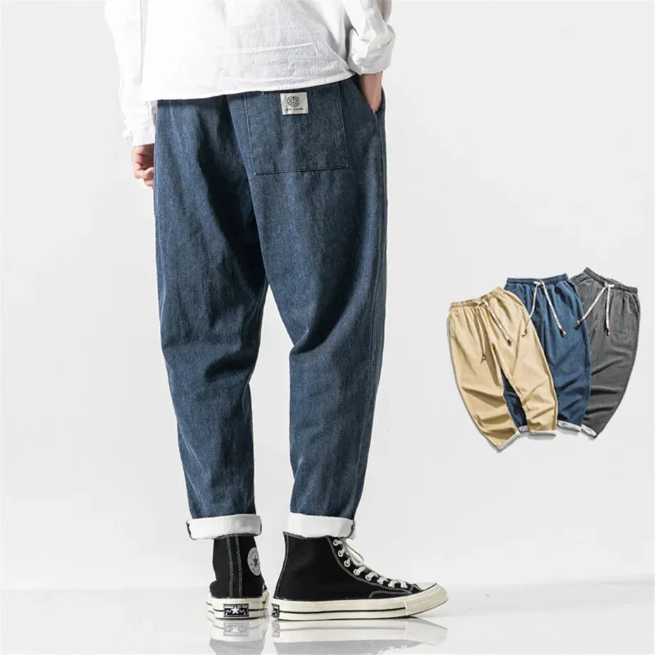 CLASSIC TAPERED DENIM PANTS