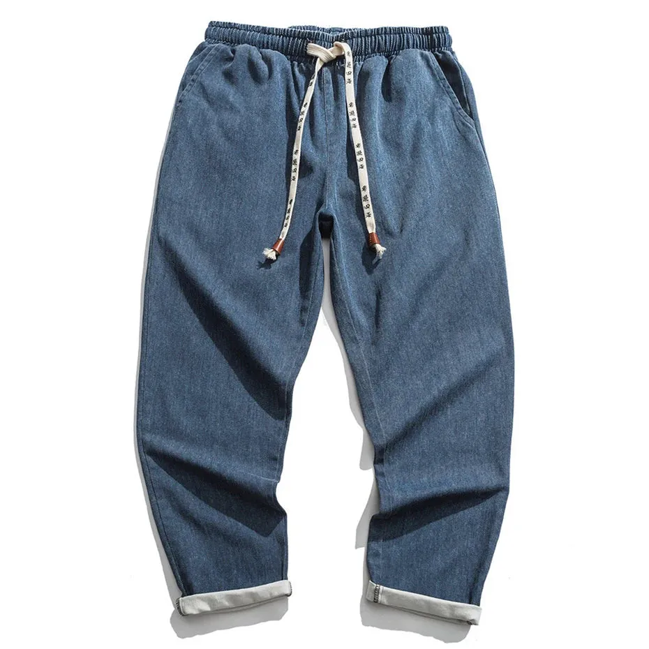 CLASSIC TAPERED DENIM PANTS
